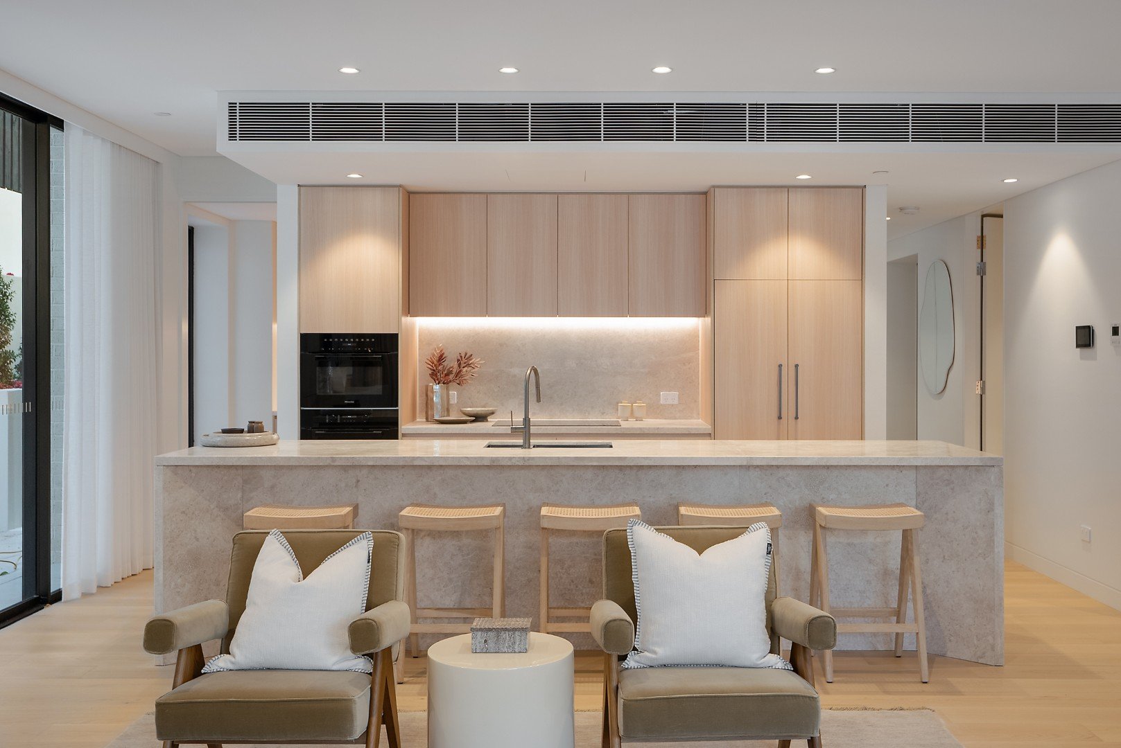 The Henry Manly kitchen with Raven limestone benchtops and premium Miele appliances